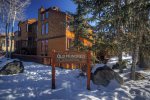 Located on the corner of the building, facing Aspen Mountain